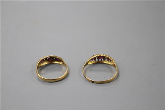 Two early 20th century 18ct gold, ruby and diamond set dress rings,
